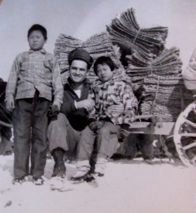 Frank poses with a couple of South Korean orphans he helped when his unit wasn’t firing its Howitzer at the enemy. Photo provided