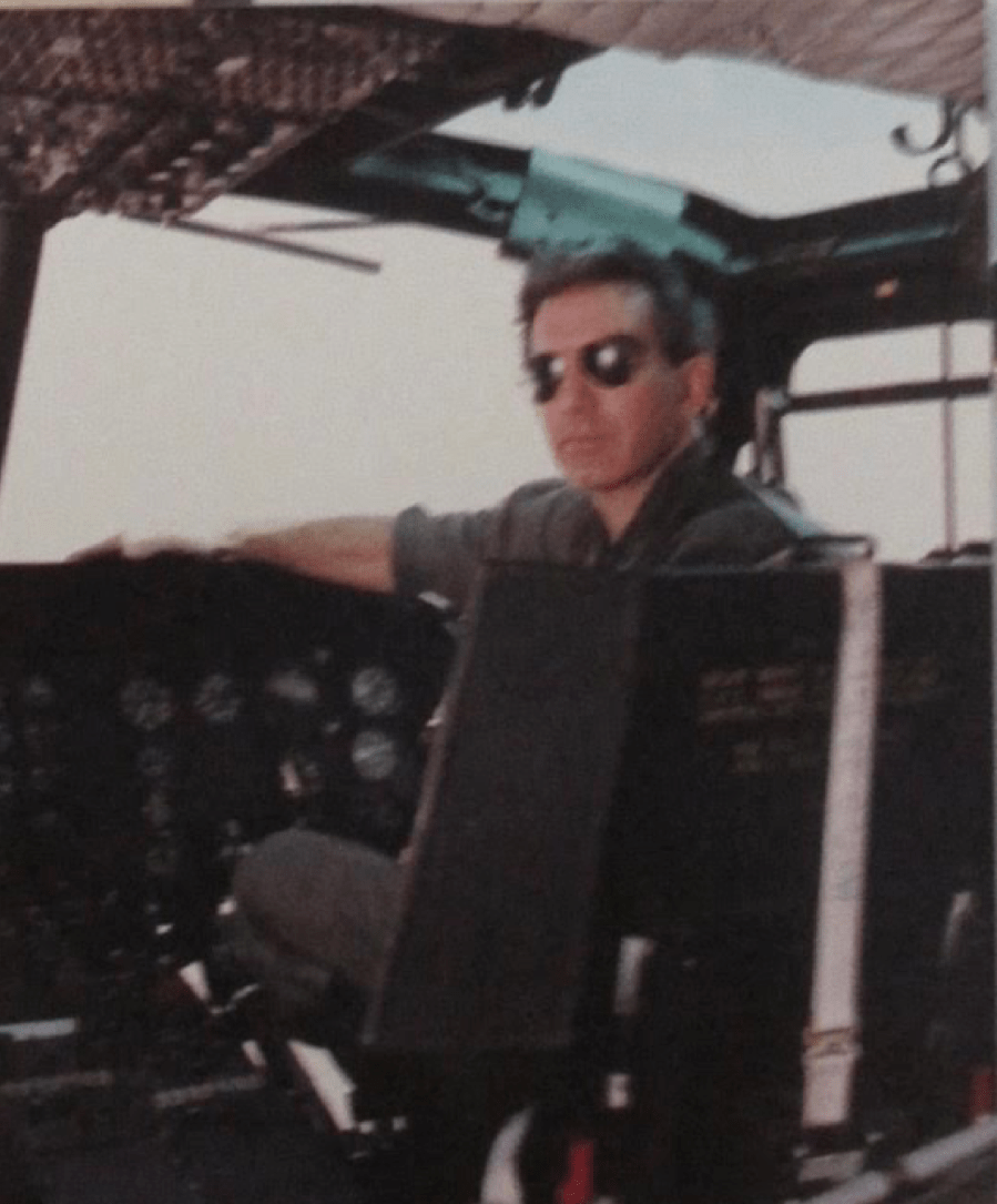 Randy Laney of Englewood sits in the pilot seat of a Huey helicopter he used to teach young Army lieutenants how to fly. He has 9,000 hours flying time in helicopters over the past 45 years. Photo provided