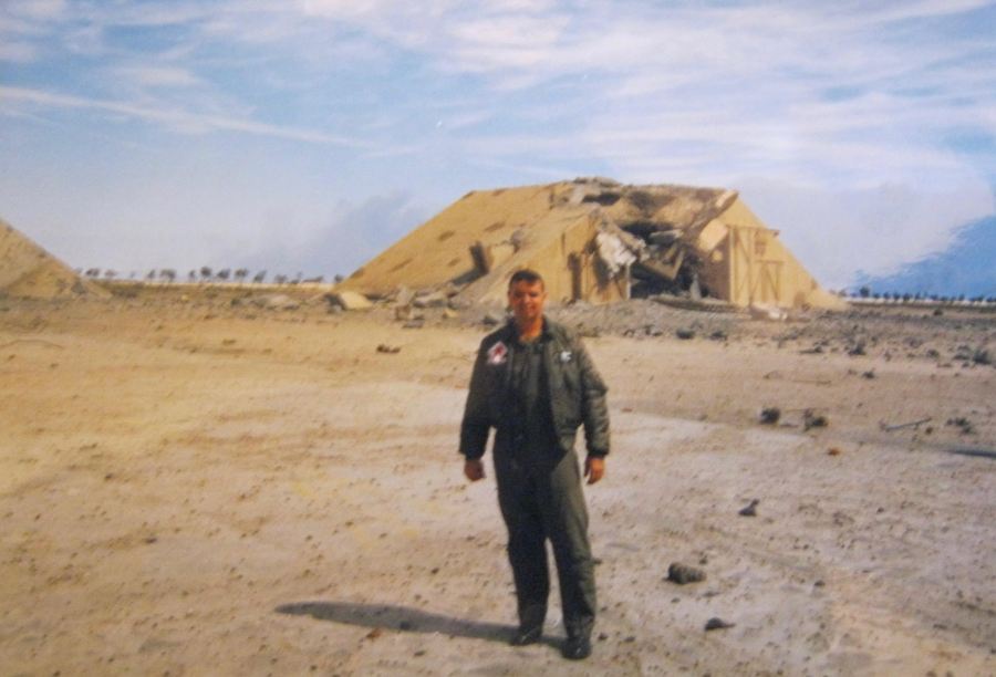 Simpson stands in front of a bombed out hanger in Kuwait that at one time housed Iranian MIG fighters. The hanger was at the Al Jaben Air Base in Kuwait. Photo provided