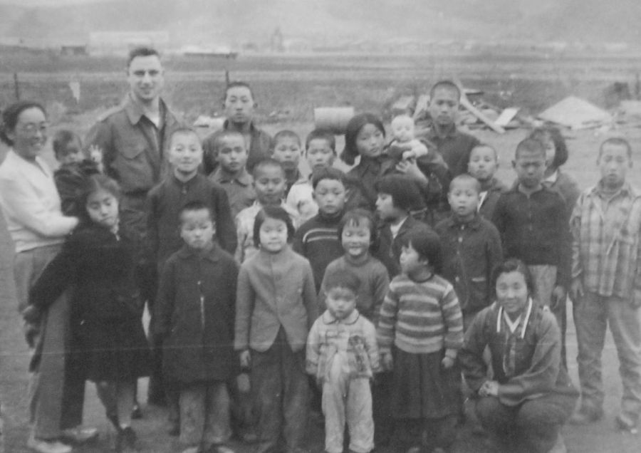 1st Lt Paul Winemiller is shown with the founder of the orphanage on the far left and a few of the children he looked after in Korea. Photo provided