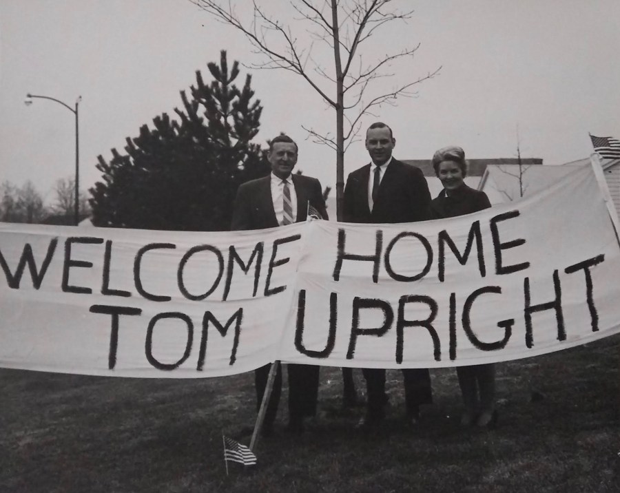 This banner was hanging from the front of the Upright’s home when Tom returned from Vietnam in April ’69. His father, Richard, is at the left, Tom center, and Helen, his mother at the right. Photo provided